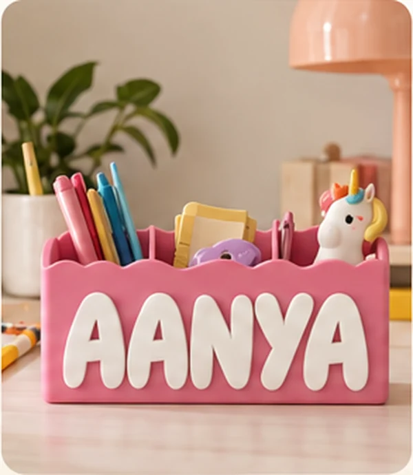 Pink personalised desk organiser filled with stationery