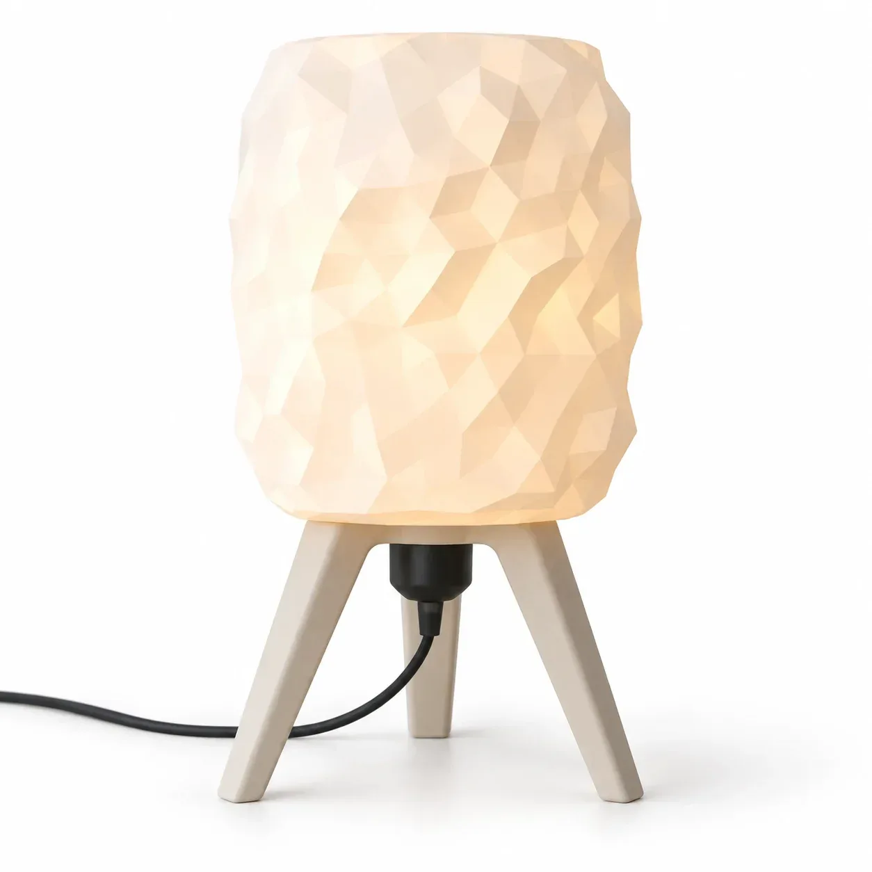 Hexa Tripod lamp glowing on a table